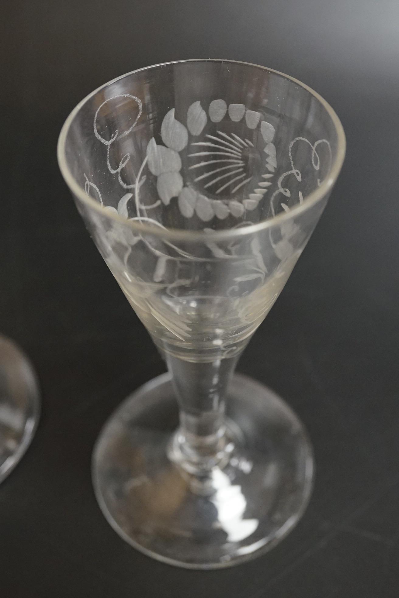 Two George III firing glasses, one with DSOT stem, together with a gin glass with engraved bowl, tallest 11.5cm high (3)